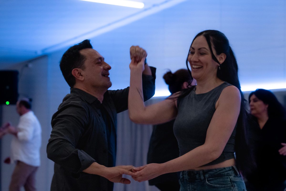 Hector dancing with a student