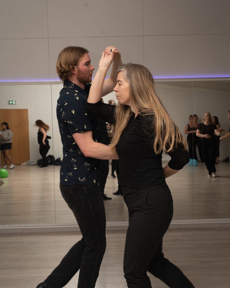 Couple dancing Cuban salsa in class